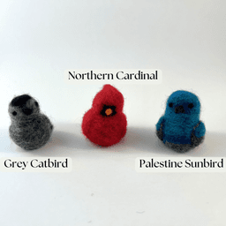 Three miniature needle felted borbs labelled left to right: grey catbird, Northern cardinal, Palestine sunbird.