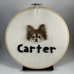 Needle-felted portrait of a brown and tan chihuahua with his name written below, Carter.