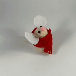 A needle-felted cream colored mouse wearing a red scarf facing 3/4 towards the right.