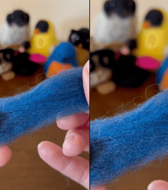 In the background, five needle-felted critters, some bespectacled, eager as students watch a demonstration on a wood table. On the left half of the image, two mostly obscured hands hold a length of blue wool fiber about an inch and a half in thickness close enough to the camera to display the fiber details. On the right side of the image, an inlay shows the fibers in closer detail.