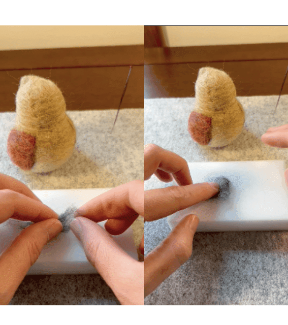 On the left side of the image, two partially obscured hands fold the right edge of a small piece of grey felting wool on top of a felting pad. On the right side, a partially obscured left hand places a finger on grey felting wool that has been shaped into a square on the felting pad.