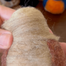 Decorative screen capture of How to handle wool for needle felting tutorial video.